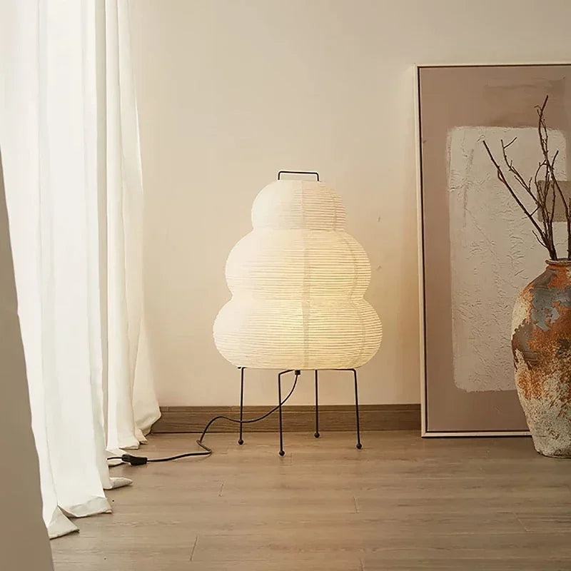 Japanese-style room with tatami mats, wooden table, and lamp.