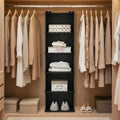 Closet with clothes hanging on racks and shelves with folded garments and boxes.