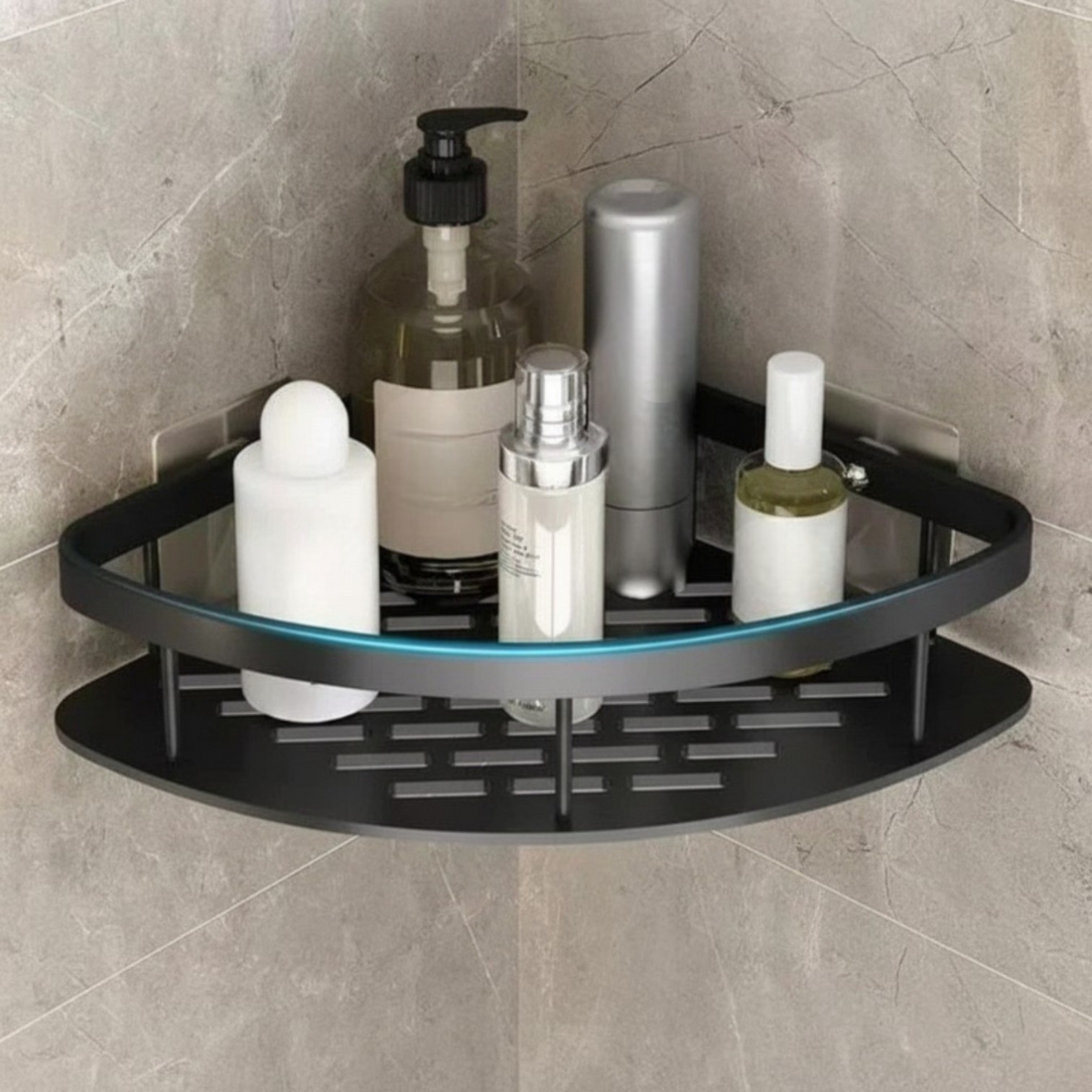 Corner shower caddy with various toiletries on a stone shower wall.