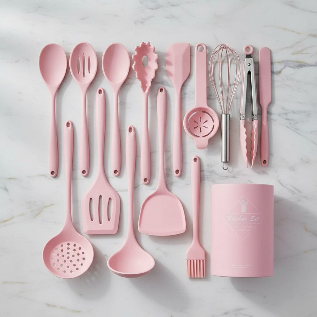 Pink kitchen utensil set on a marble surface
