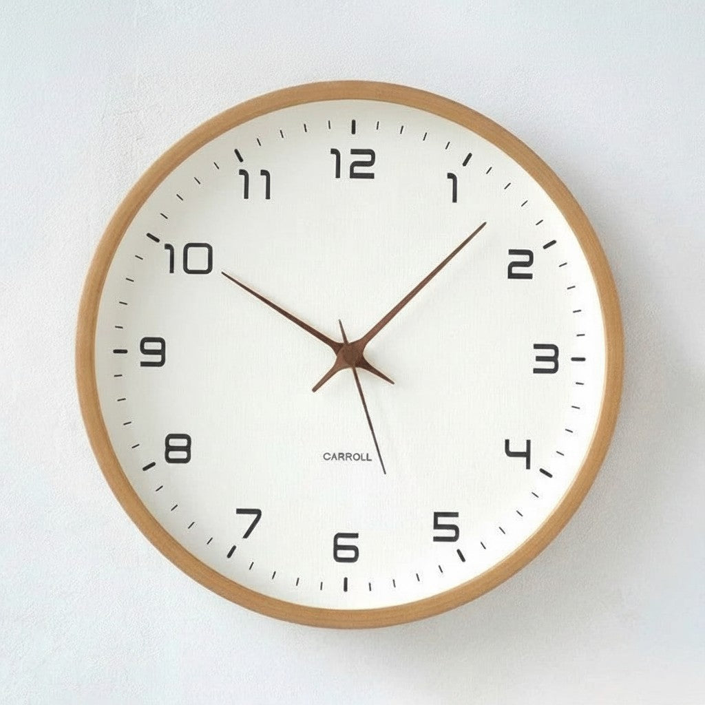 Tidings & Twinkle minimalist 10-inch round wooden wall clock with a white face and black Arabic numerals.